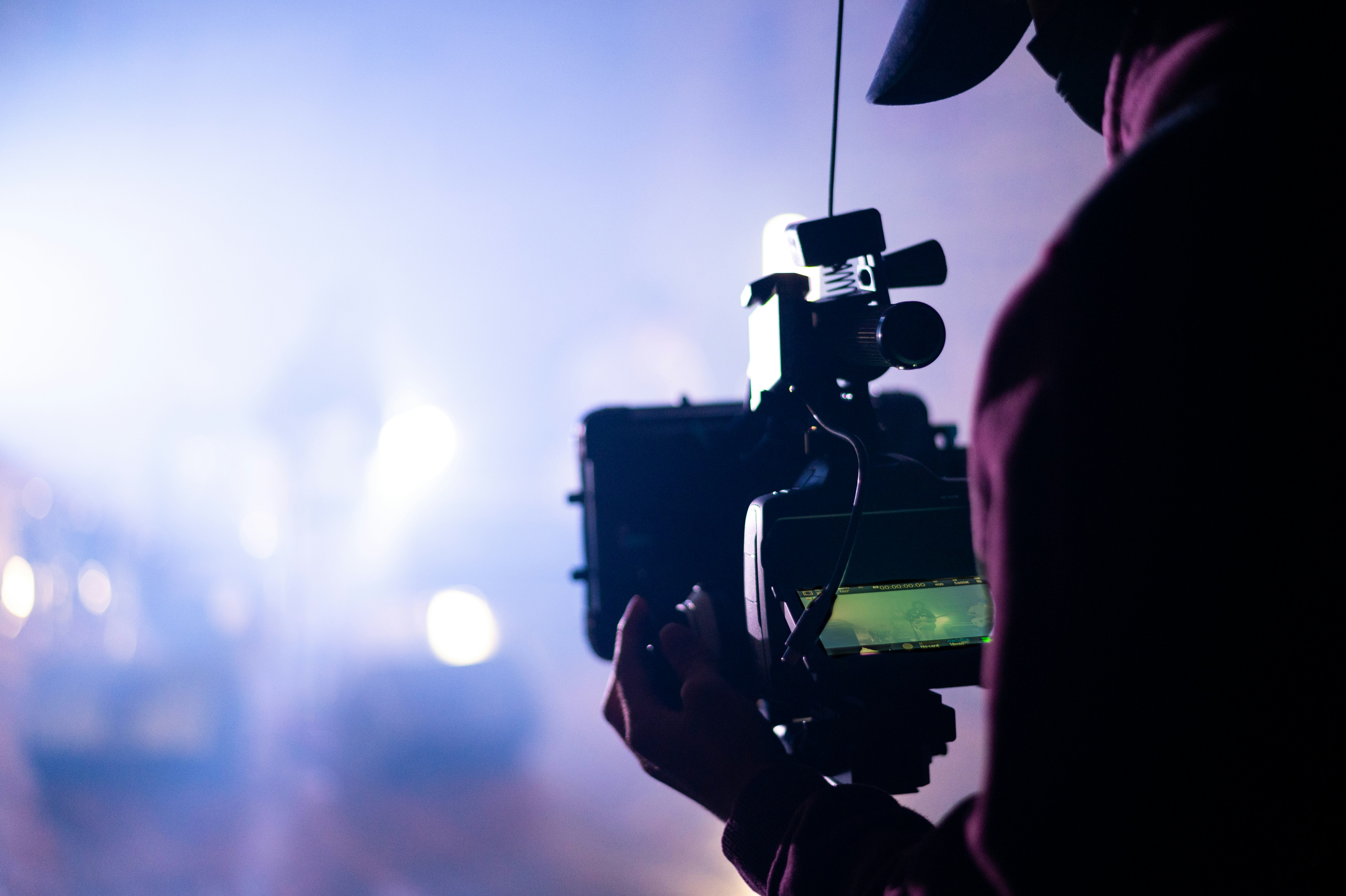 person holding black video camera